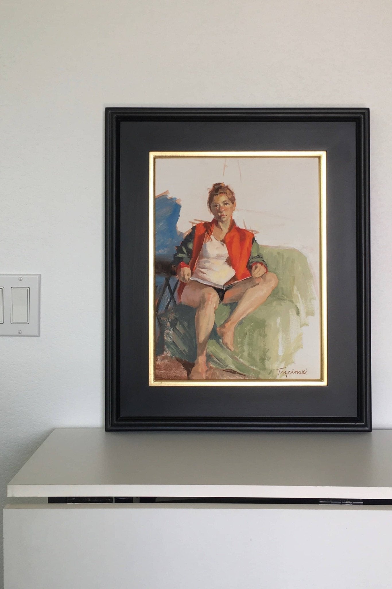 female figurative art with strong red and blue color draws tranquility to this office room