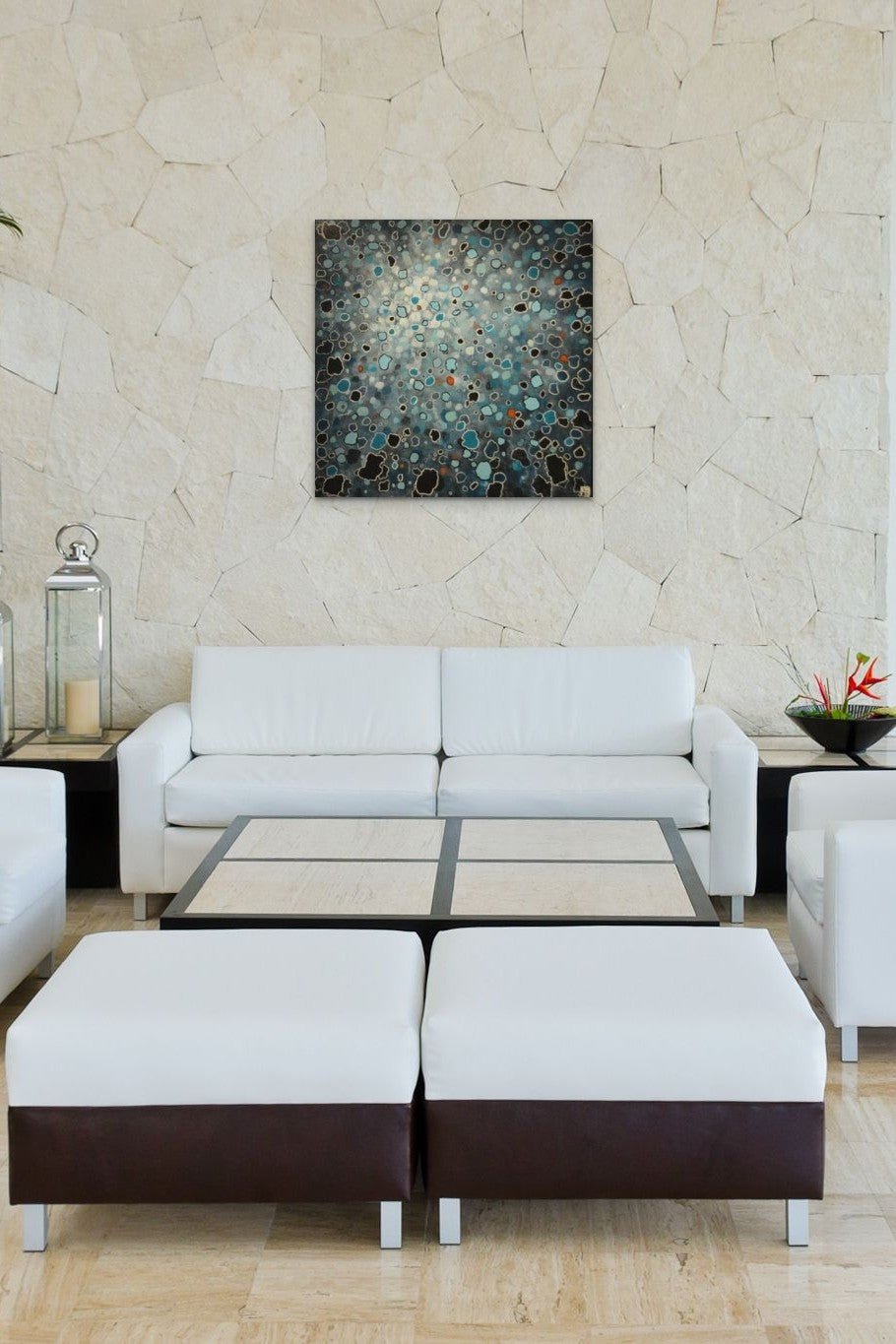 Abstract artwork in black, blue & red colors fills this spa with energy and calm