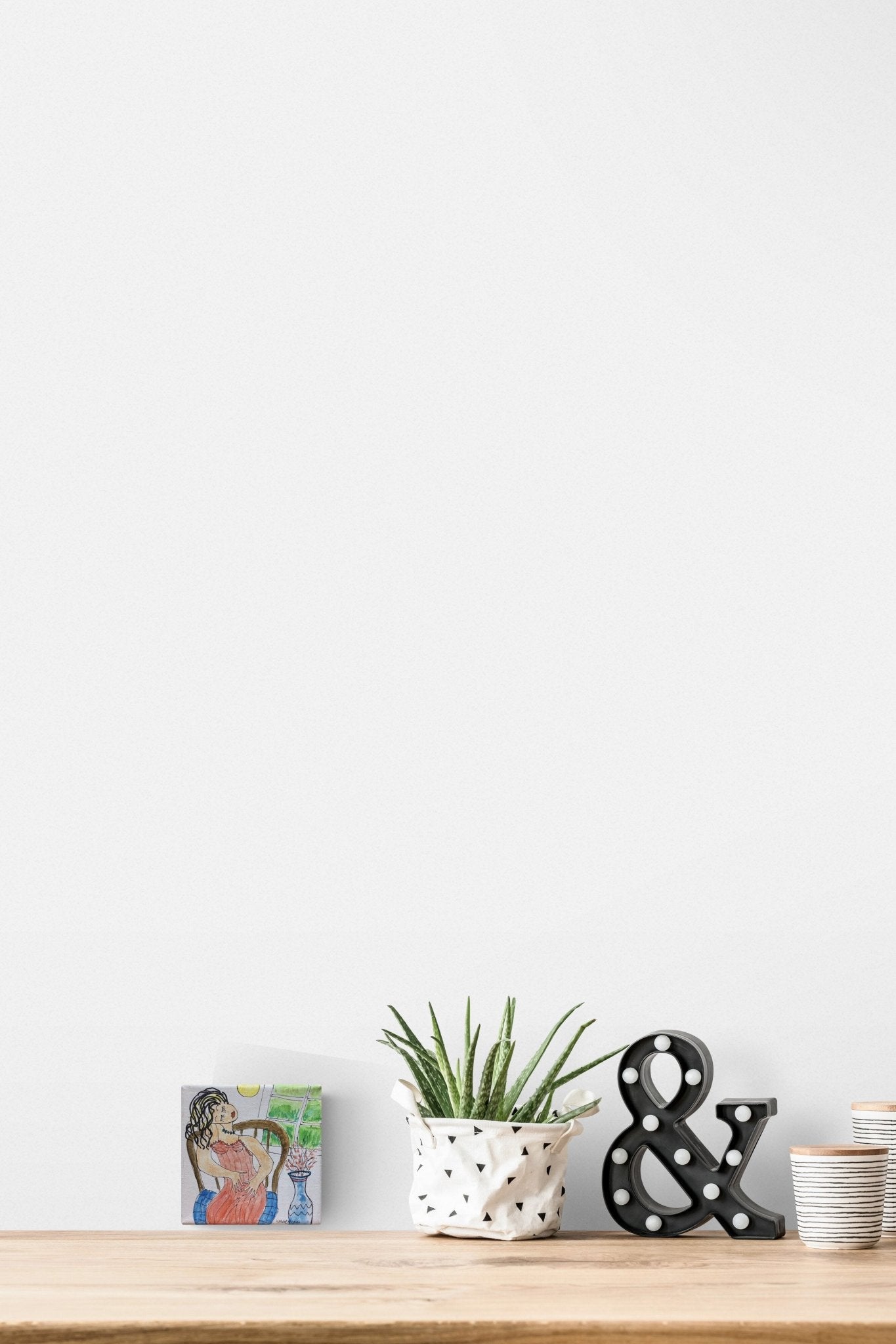 Small Scale Figurative Painting with playfulness adds life to this table