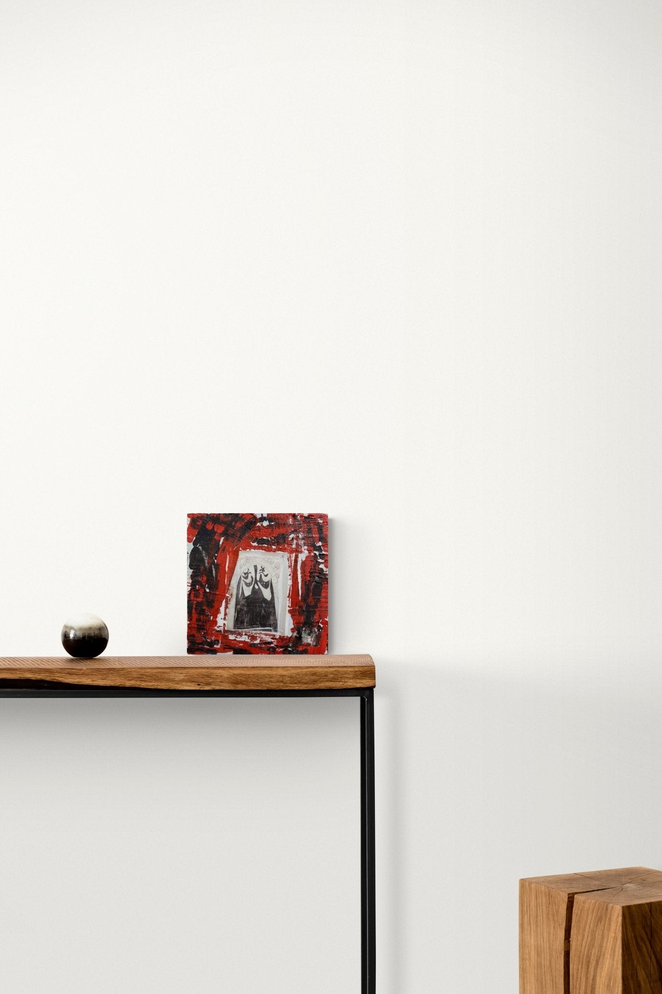 Abstract Portrait Painting adds bold red color, conversation and culture to this hallway