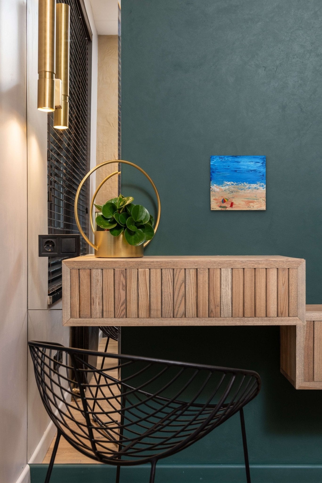 Impressionistic abstract beach painting adds life and color to this modern sitting area