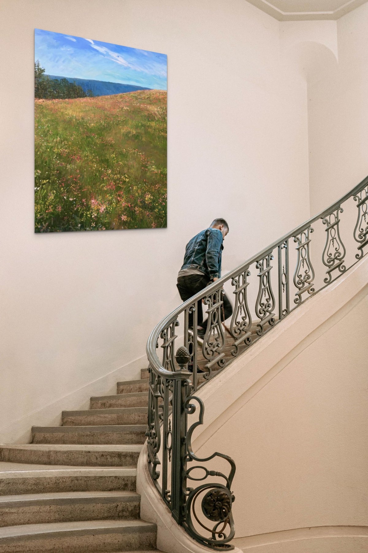 Landscape Artwork adds nature, blue & green to this classic staircase