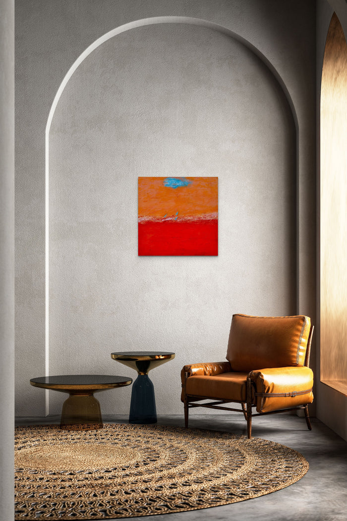 Abstract artwork in red, orange & blue adds energy and color to this living space