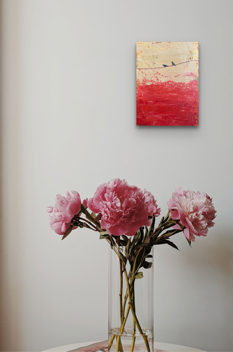 Impressionistic Abstract bird painting adds emotion and color to this table with flowers