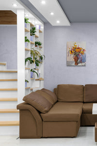 Contemporary Floral Painting, earthly yellow colors adds life to this family room
