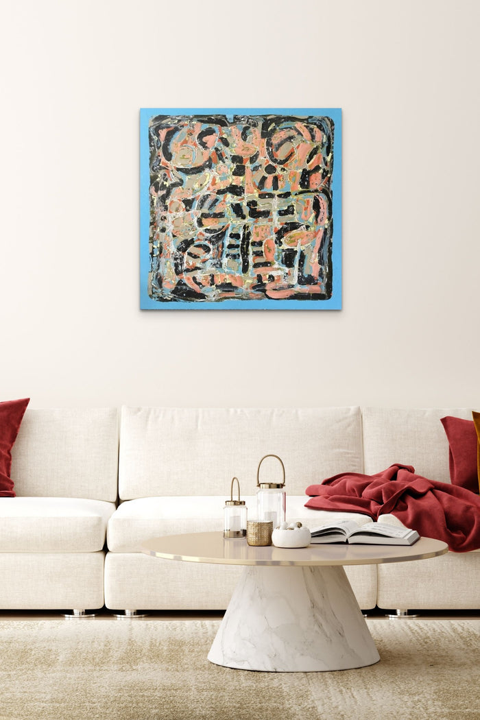 Abstract Artwork in bold blue, black & pink colors fills this living room with energy