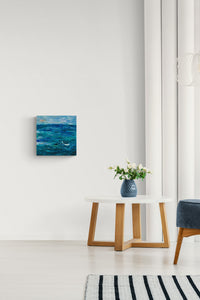 Seascape impressionistic painting fills this living space with emotion & deep blue color