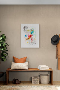 Abstract expressionistic painting adds conversation to this entry wall with color