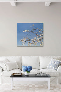 Tree Artwork in blue and white fills this living room with nature and life