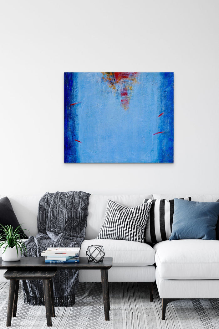 Abstract Painting of blue Fireworks on the Ocean adds color & life to this living room