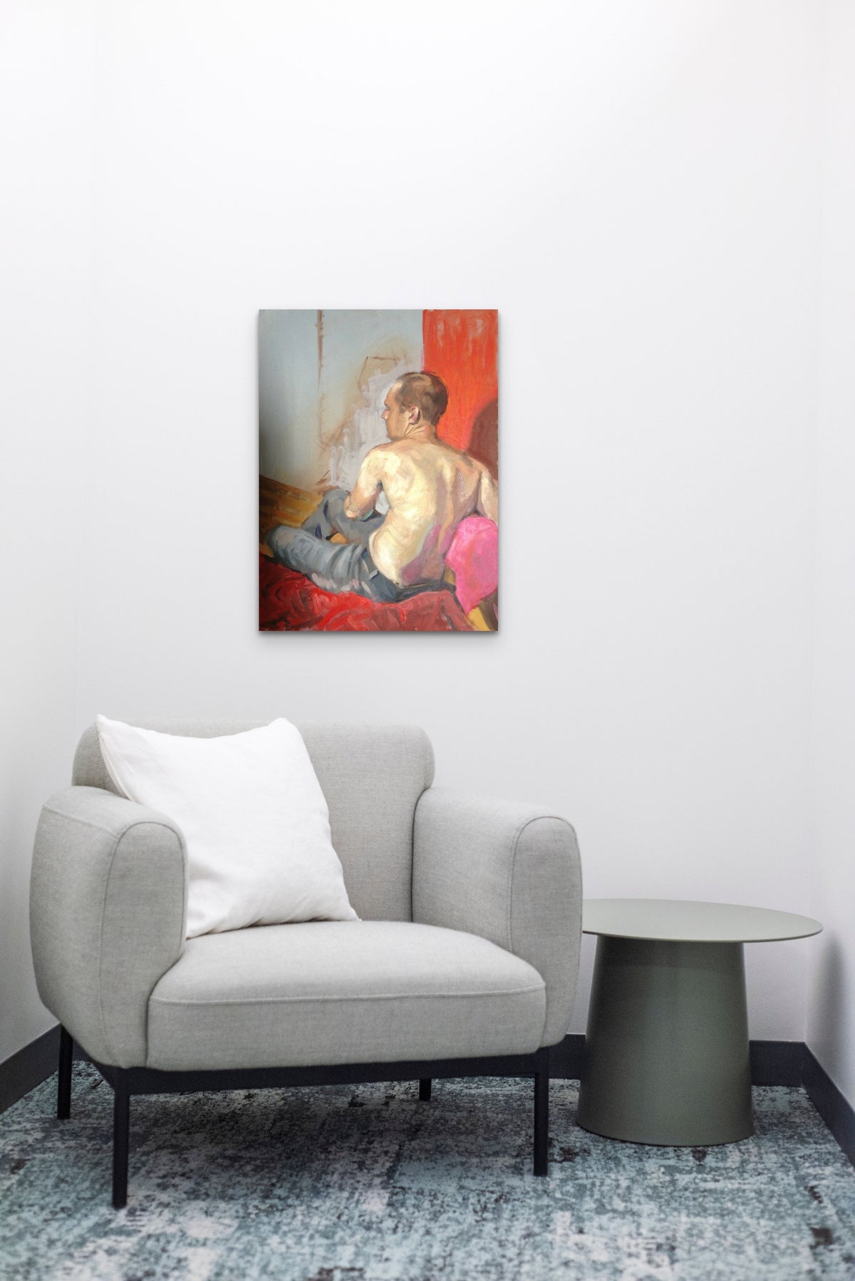 Male figurative Painting brings red color & feeling of emotion to this minimal sitting room
