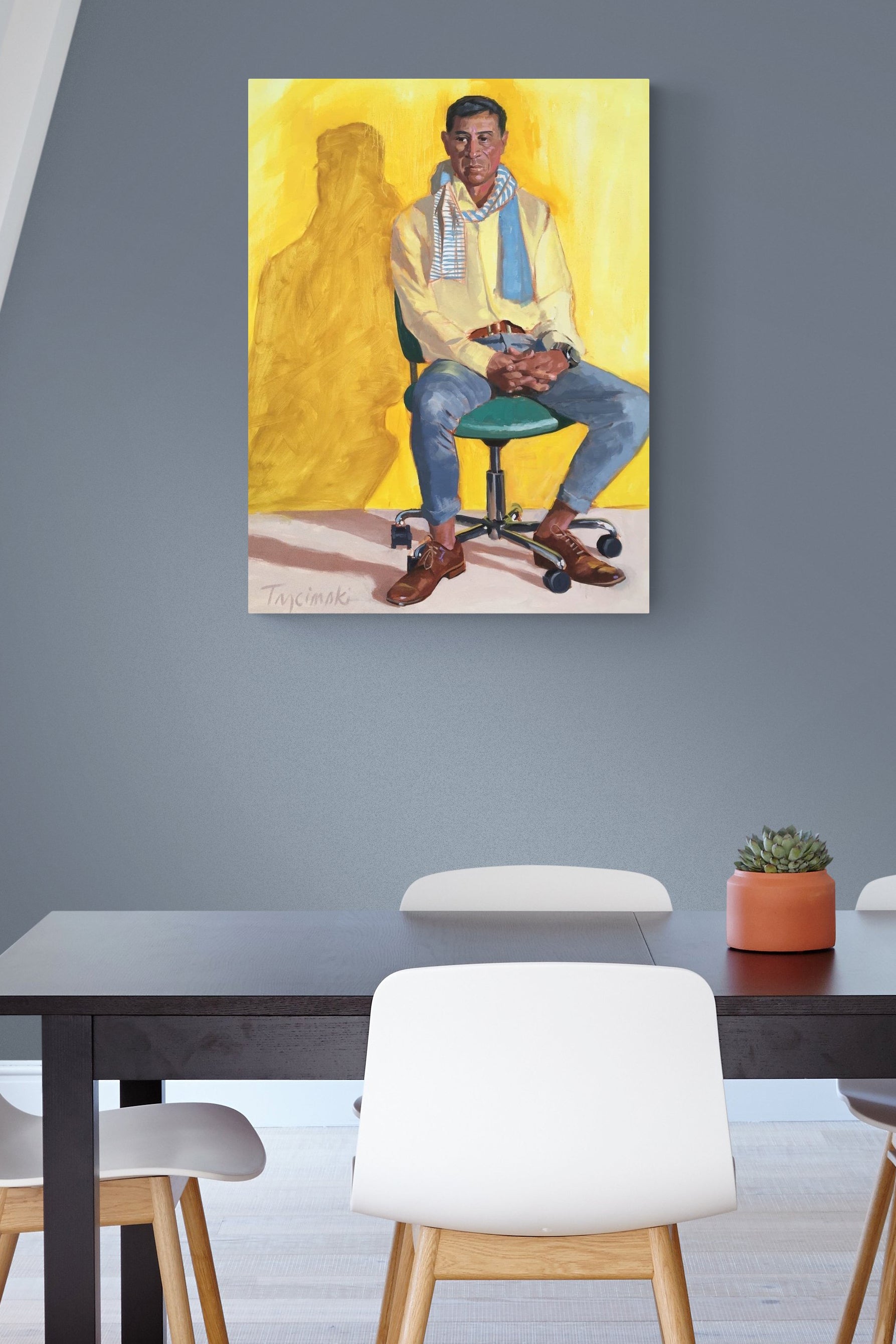 male figurative yellow & blue painting brightens up this simple office space
