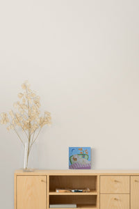 Small Scale Female figurative painting with blue pairs well with this natural bedroom