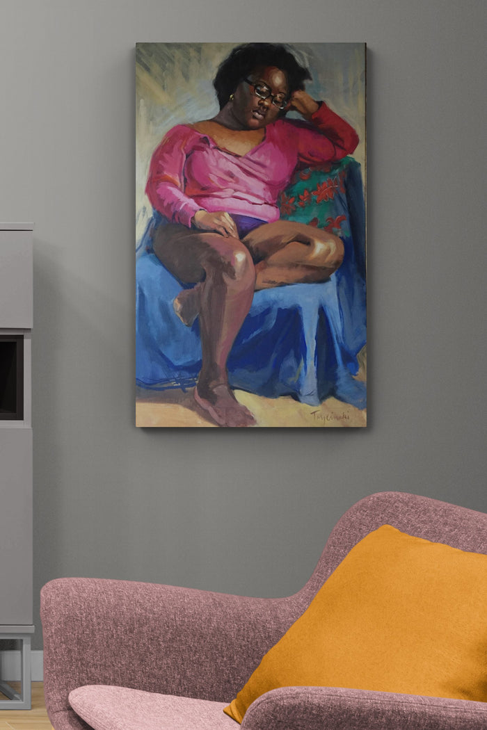 contemporary female figure art with its jewel tone blue color brings life to this family room