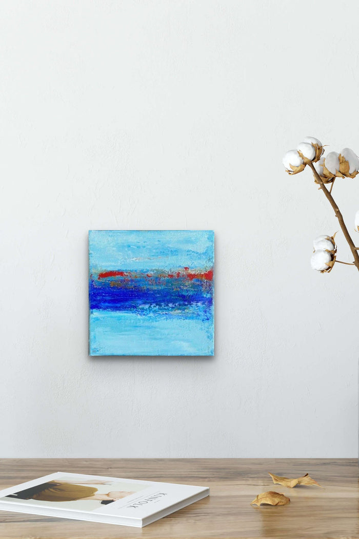 Small Scale Impressionistic Ocean Abstract painting adds color, texture and life to this table
