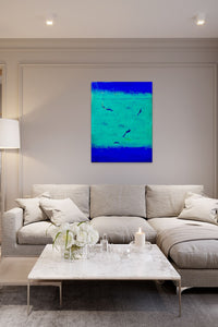 Abstract artwork in green & blue colors fill this elegant living room with life & energy