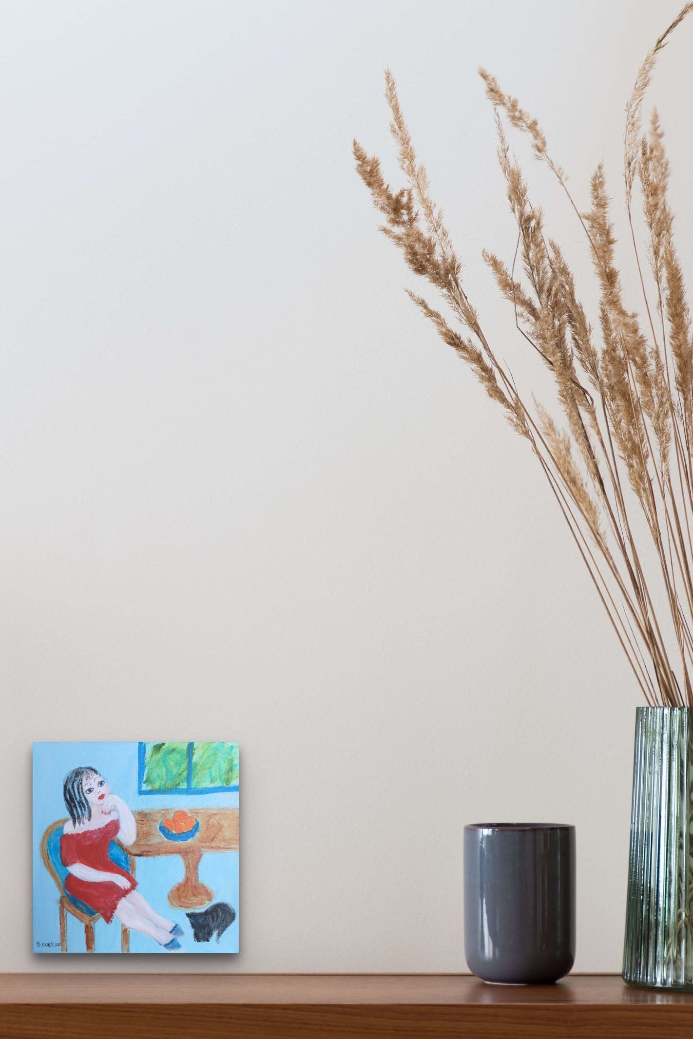 Small Scale Female Figurative Painting adds thought, life & color to this dining area