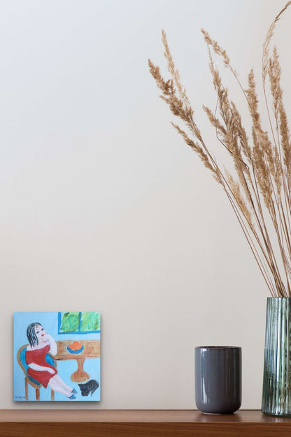 Small Scale Female Figurative Painting adds thought, life & color to this dining area